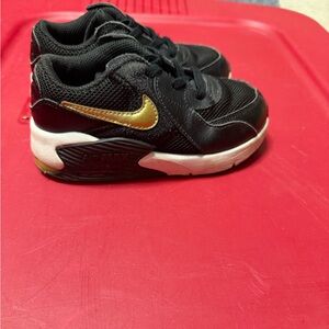 Nike Kids Black and Gold Swoosh Athletic Sneakers